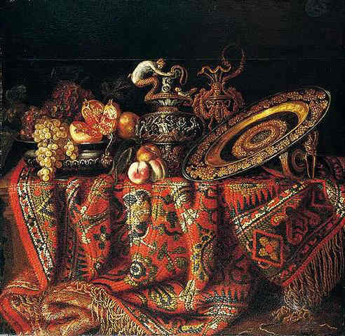 Jacques Hupin A still life of peaches, grapes and pomegranates in a pewter bowl, an ornate ormolu plate and ewers, all resting on a table draped with a carpet